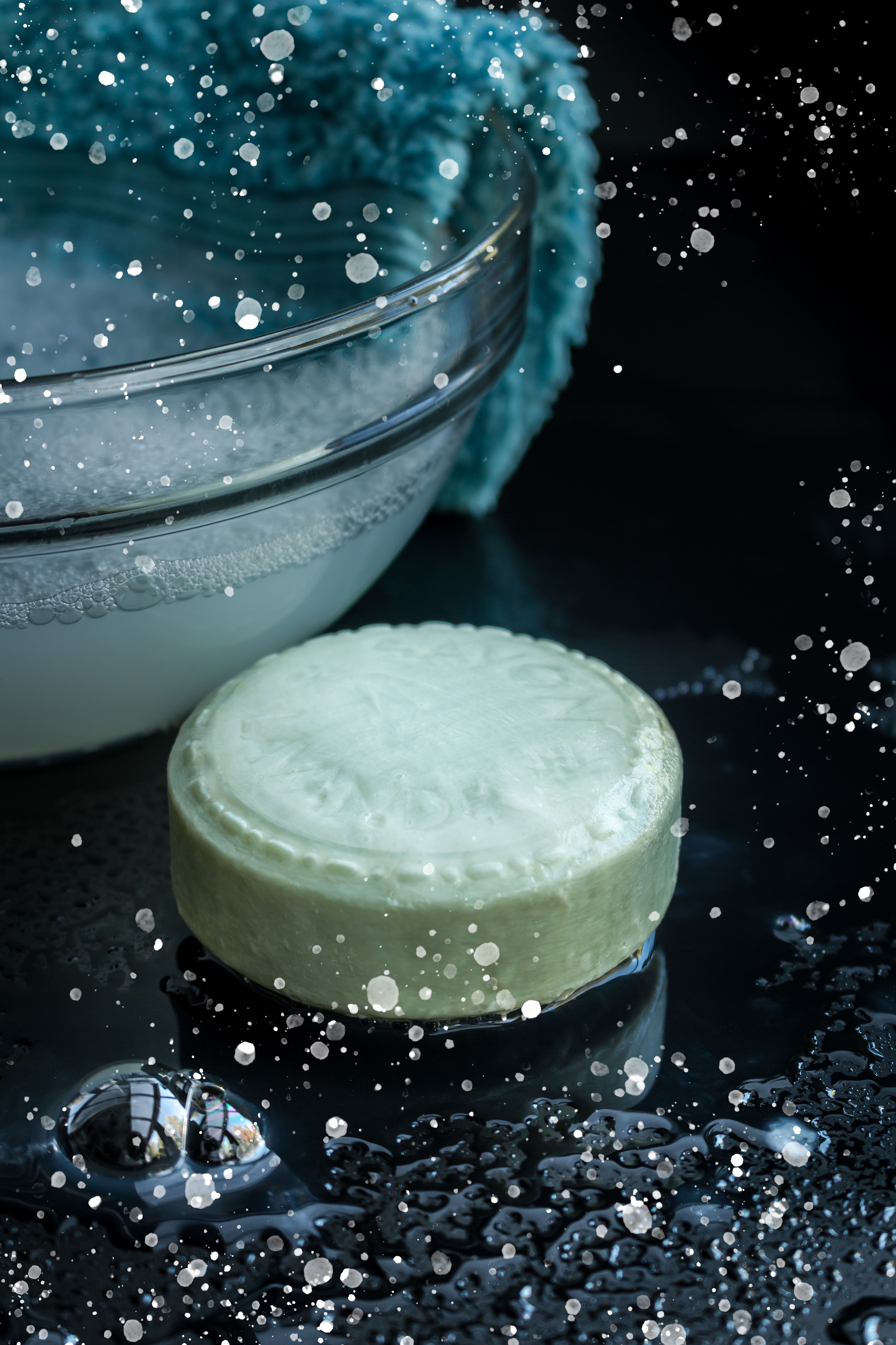 Close-Up of Green Soap and Bubbles on Dark Surface · Free Stock Photo