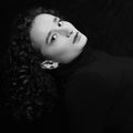 Portrait against a plain backdrop, photo by Eric QUINONES on Pexels