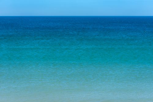 Free Calm and expansive blue ocean under clear sky, perfect for peaceful ambiance. Stock Photo