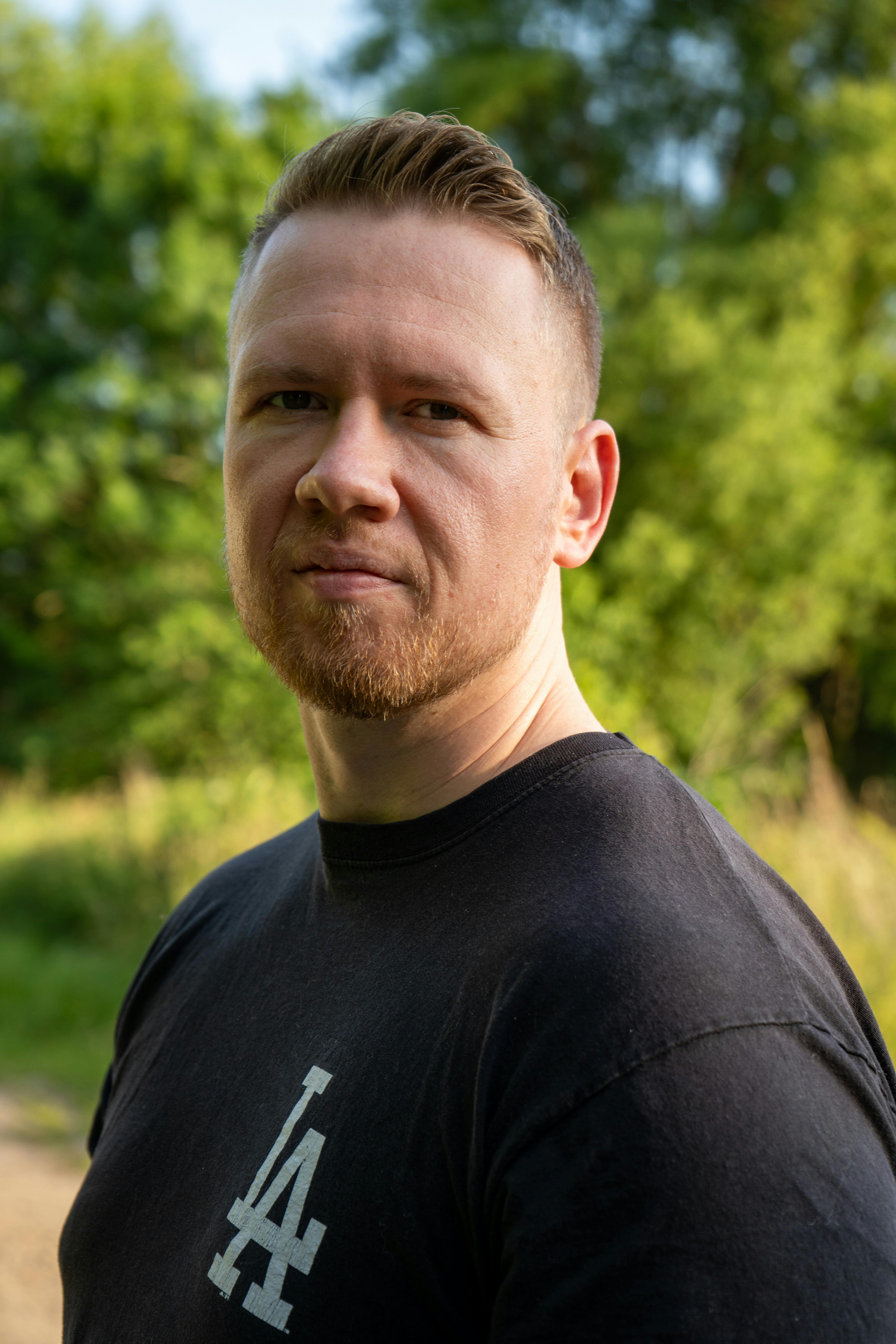 Casual portrait of a man outdoors in natural sunlight