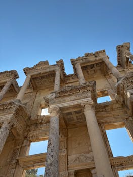 Stunning view of ancient Roman ruins under a clear blue sky.