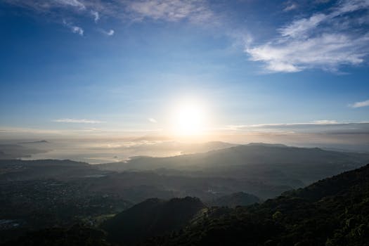 Stunning aerial view of sunrise over mountains and clouds in San Salvador, El Salvador.