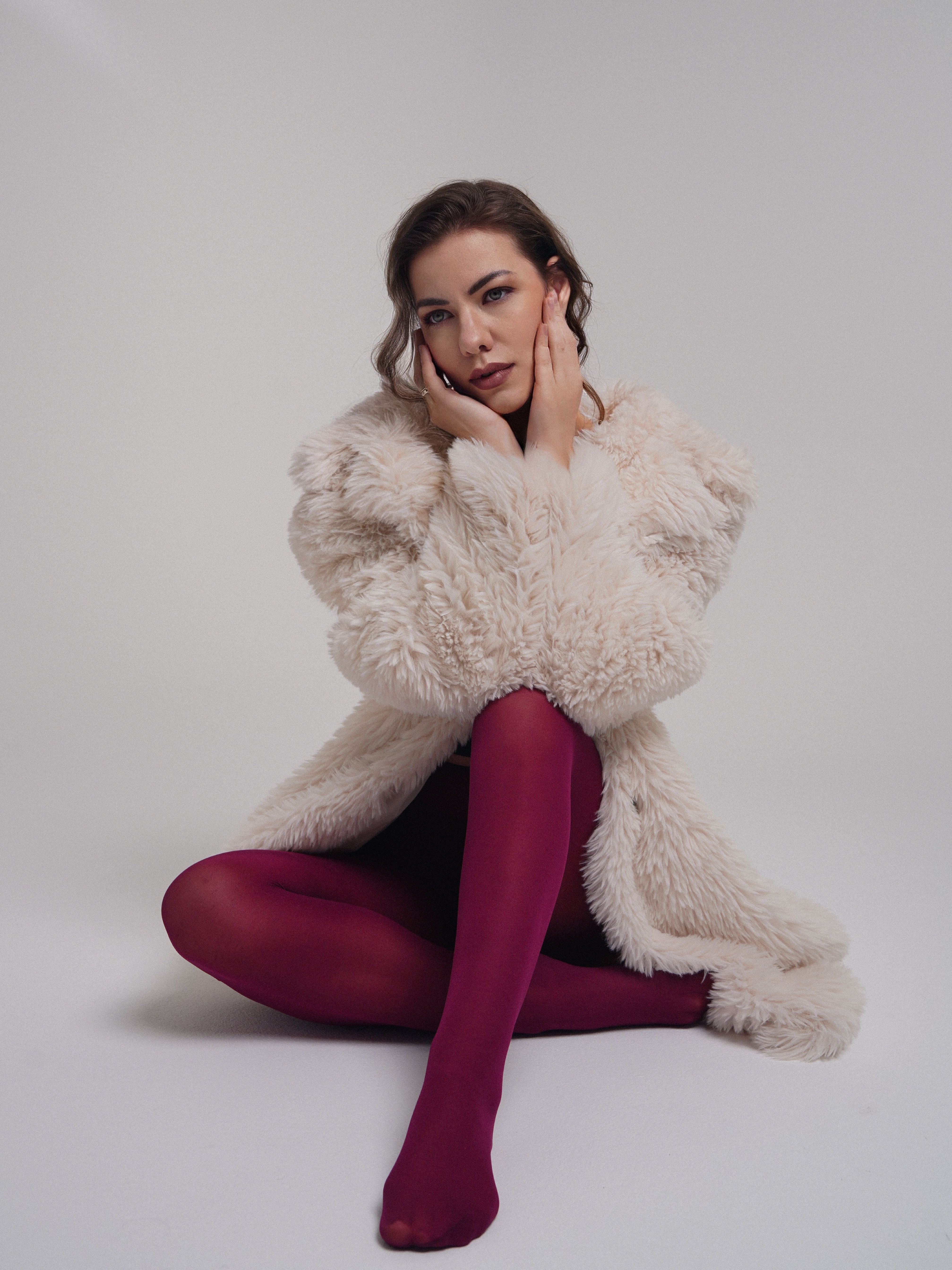 Elegant Woman in Fur Coat on White Background · Free Stock Photo