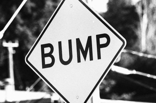 Free Black and white photo of a bump road sign in Seattle, capturing urban street elements. Stock Photo