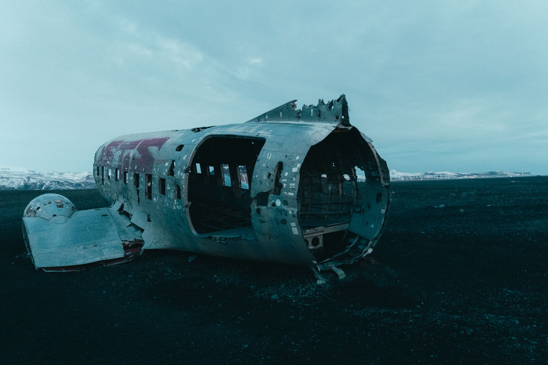 Explore the eerie wreck of a crashed plane on Iceland's Solheimasandur beach.