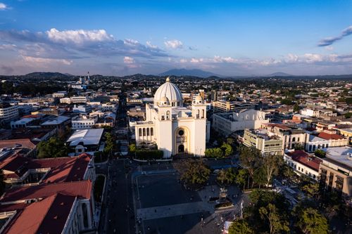 Free Stunning aerial view of San Salvador Cathedral and surrounding cityscape at sunset. Stock Photo