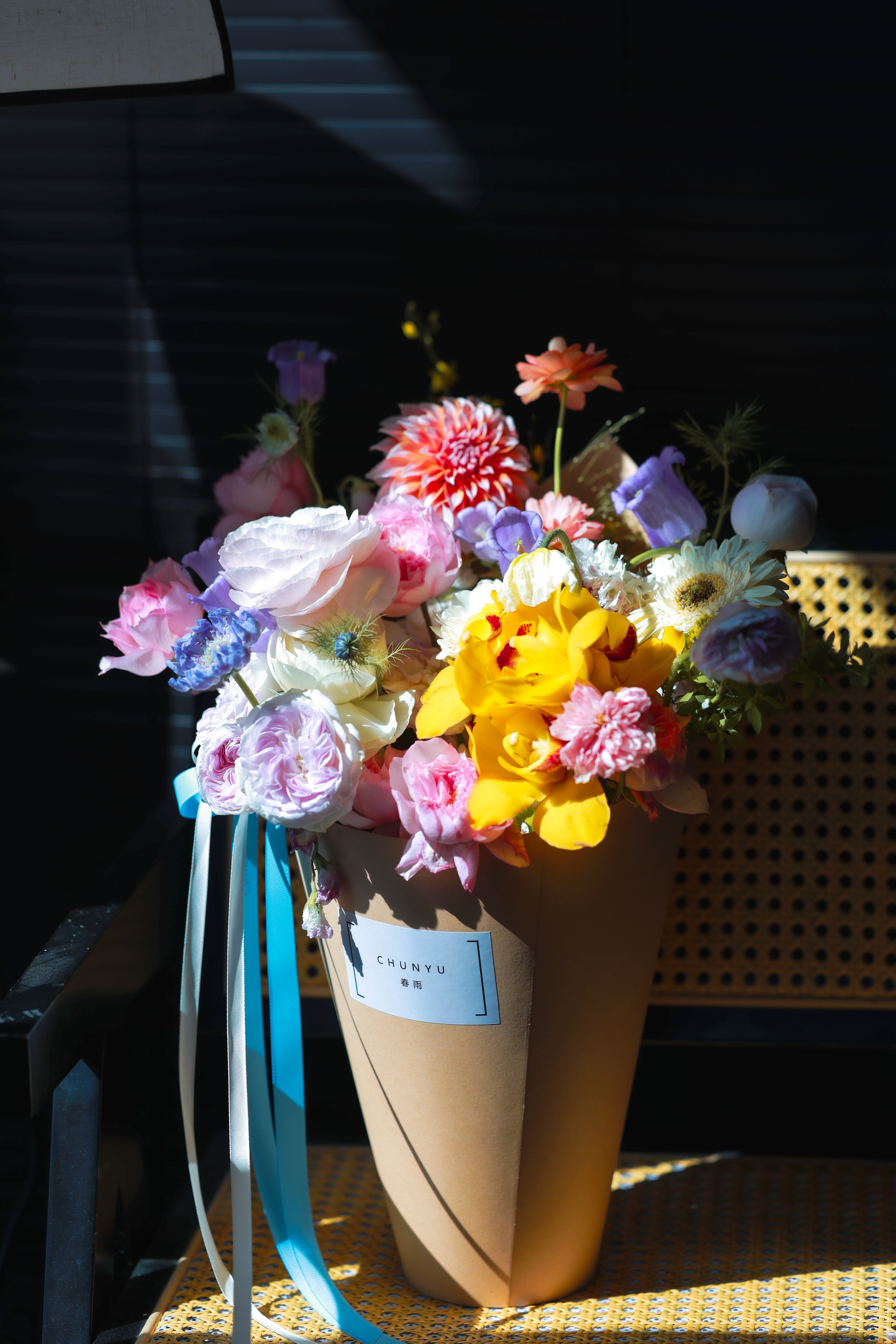 A colorful bouquet of mixed flowers in natural light, perfect for spring themes.