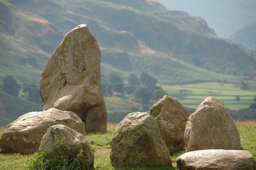 Free Monolithic stone formation amidst a scenic valley landscape, showcasing natural beauty. Stock Photo