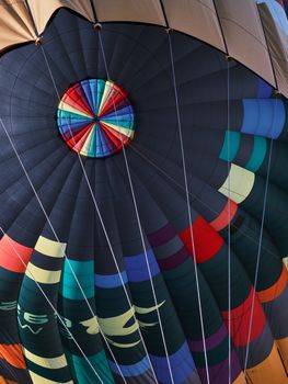 Detailed close-up of a colorful hot air balloon canopy with vibrant patterns.