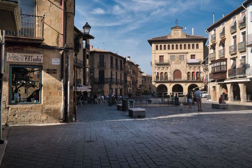 Free Historic plaza with traditional architecture in Laguardia, Spain. A sunny day highlighting rustic facades. Stock Photo