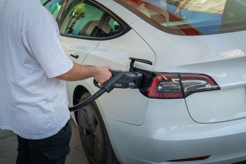 Electric car plugged into a home charger