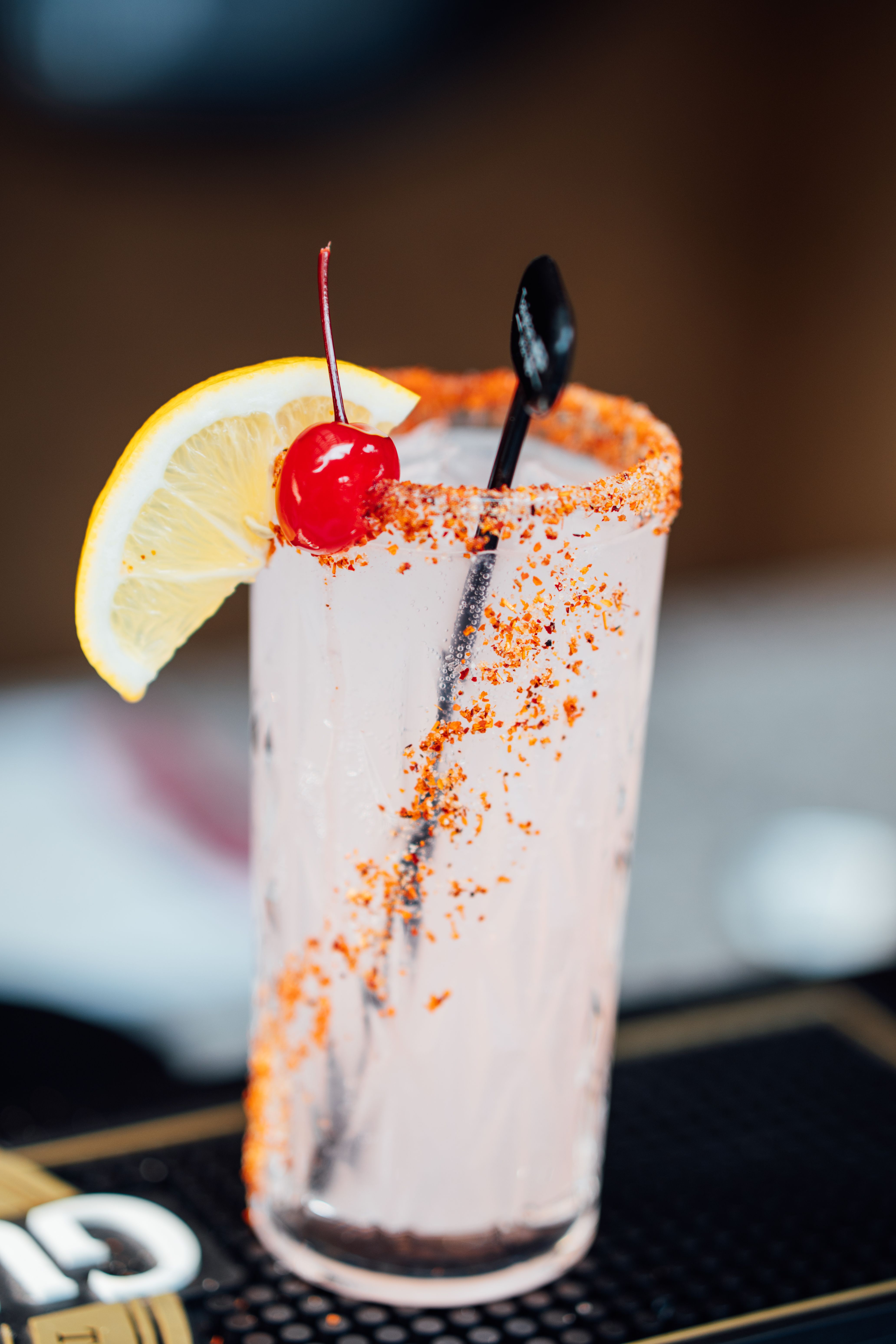 Refreshing Cocktail with Lemon and Cherry Garnish · Free Stock Photo