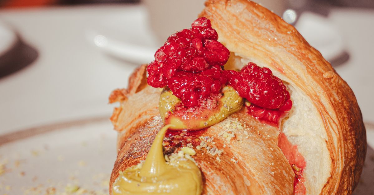 Costa Raspberry Croissant Delicious Croissant with Raspberries and Pistachio Cream · Free Stock Photo