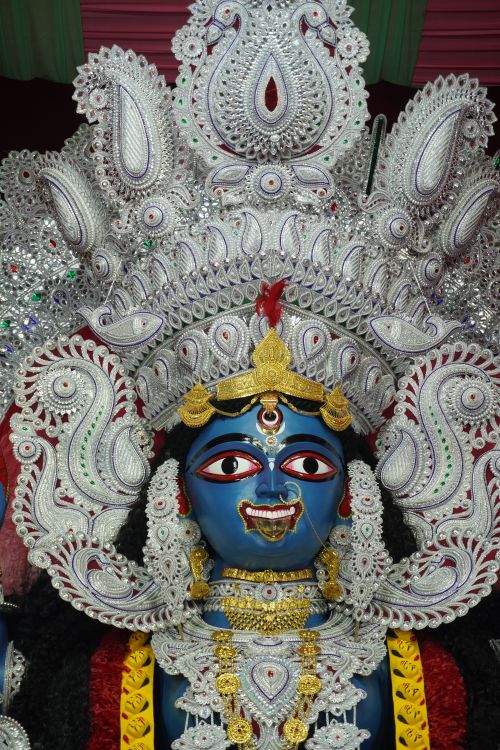 Free Detailed image of a traditional Durga idol with colorful and ornate decorations, ideal for cultural and festive themes. Stock Photo