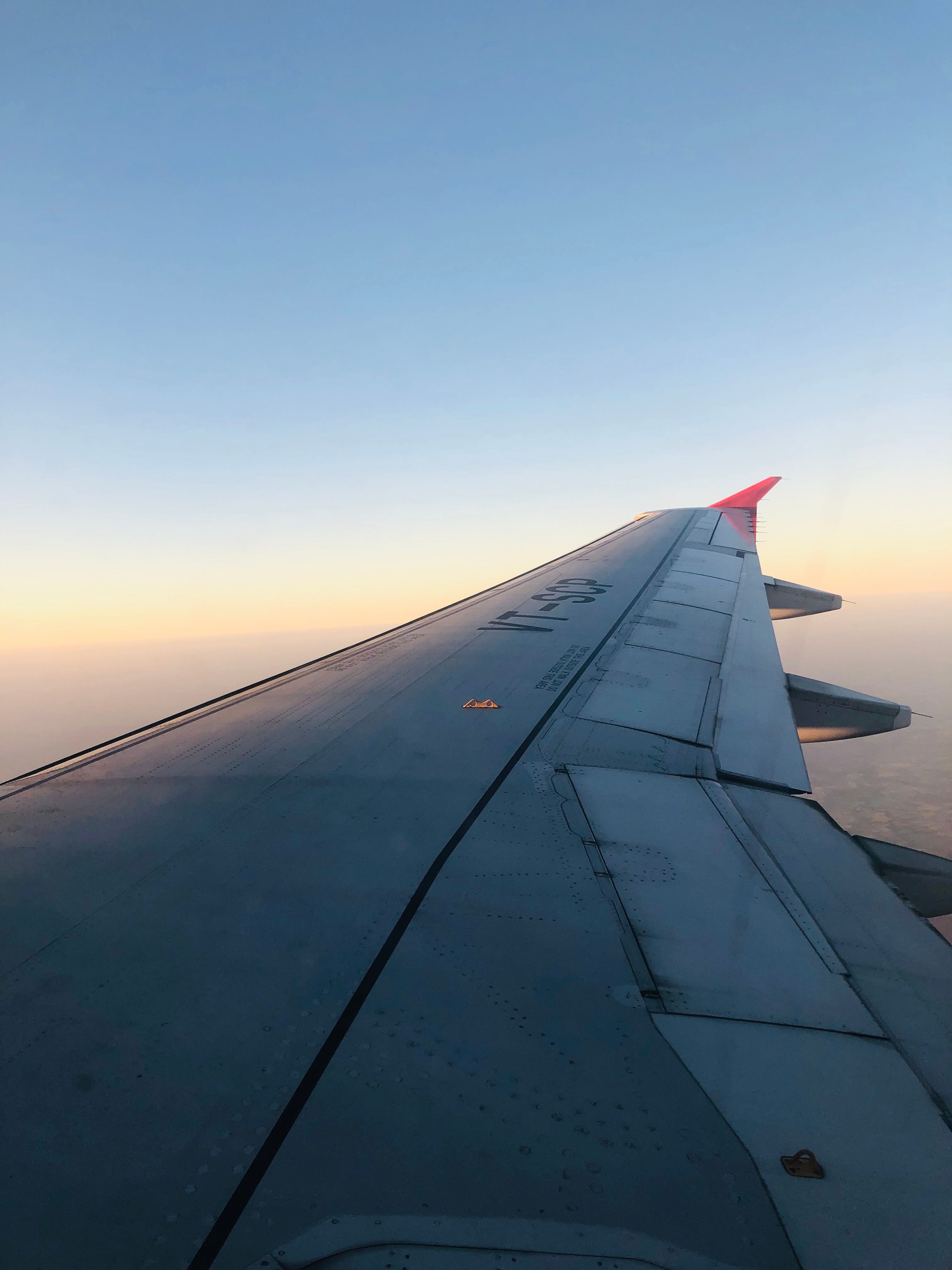 Airplane Wing View at Sunrise in Flight · Free Stock Photo
