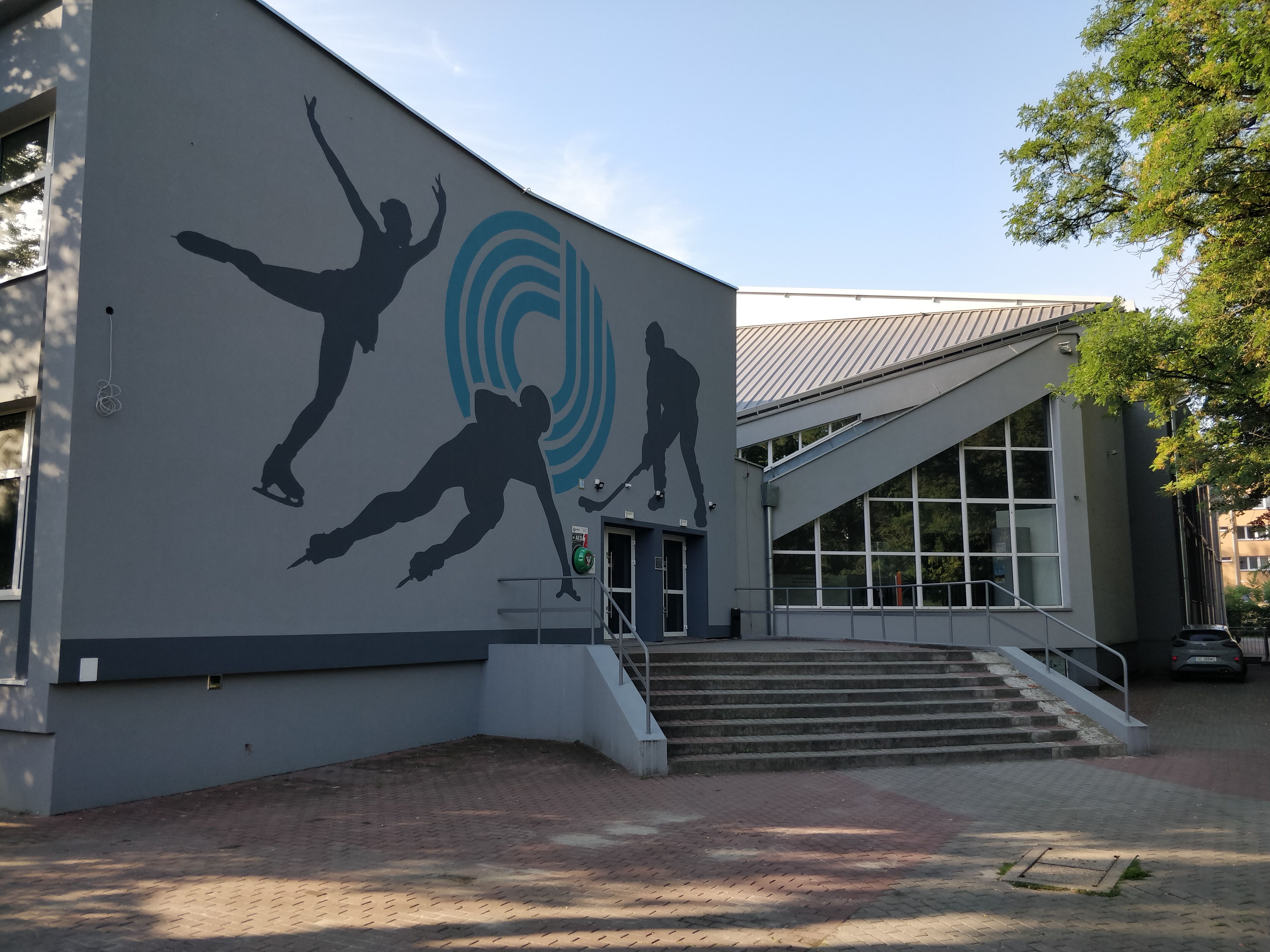Modern Ice Rink Entrance with Skating Mural · Free Stock Photo