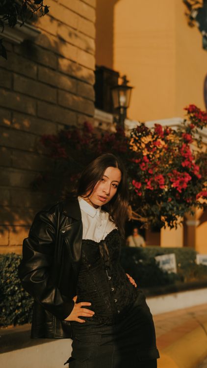 Stylish Woman Posing Outdoors in Evening Light · Free Stock Photo