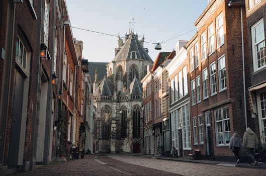 Charming street view of Dordrecht with stunning historic architecture captured in daylight.