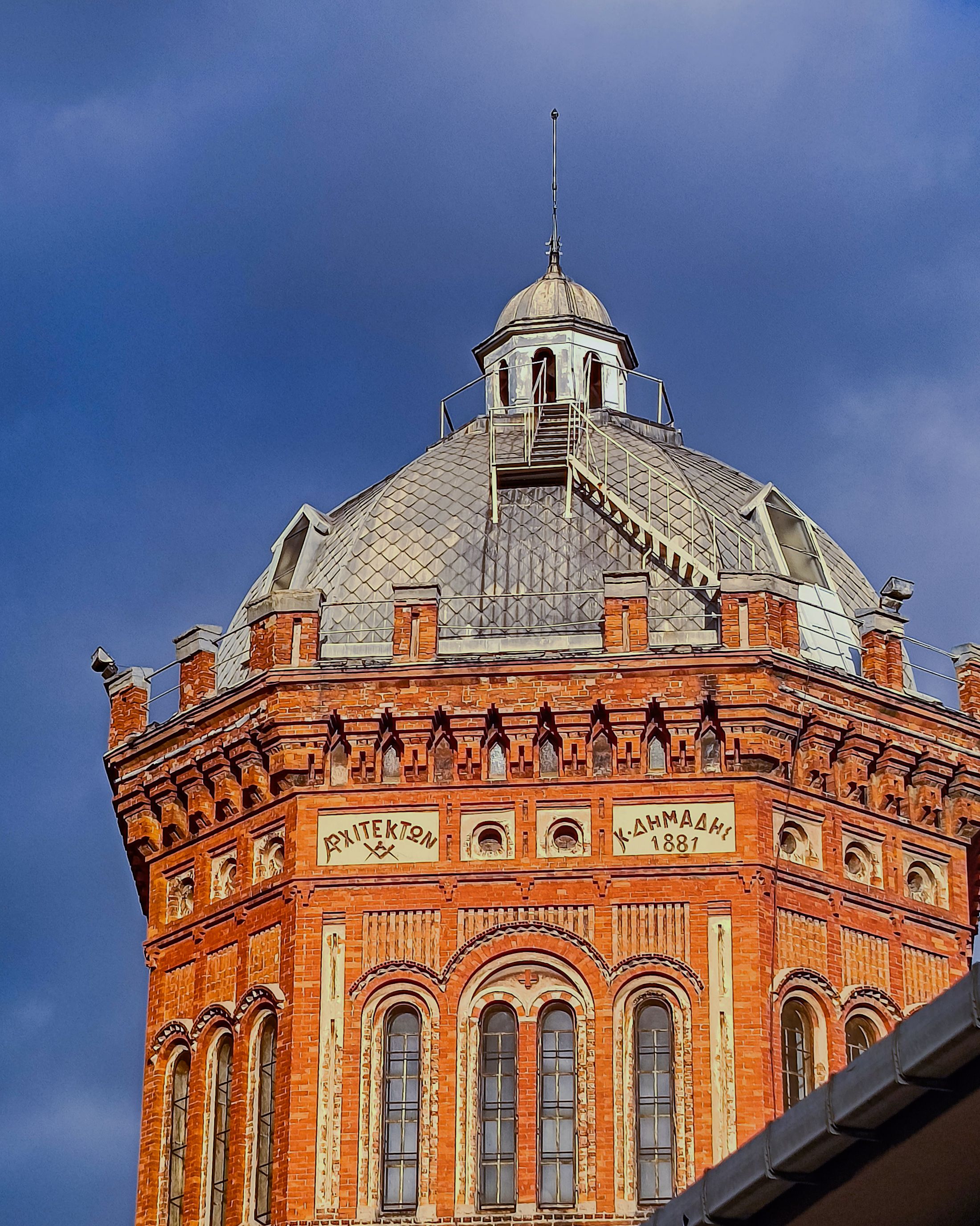 Historic Brick Architecture Against Stormy Sky · Free Stock Photo