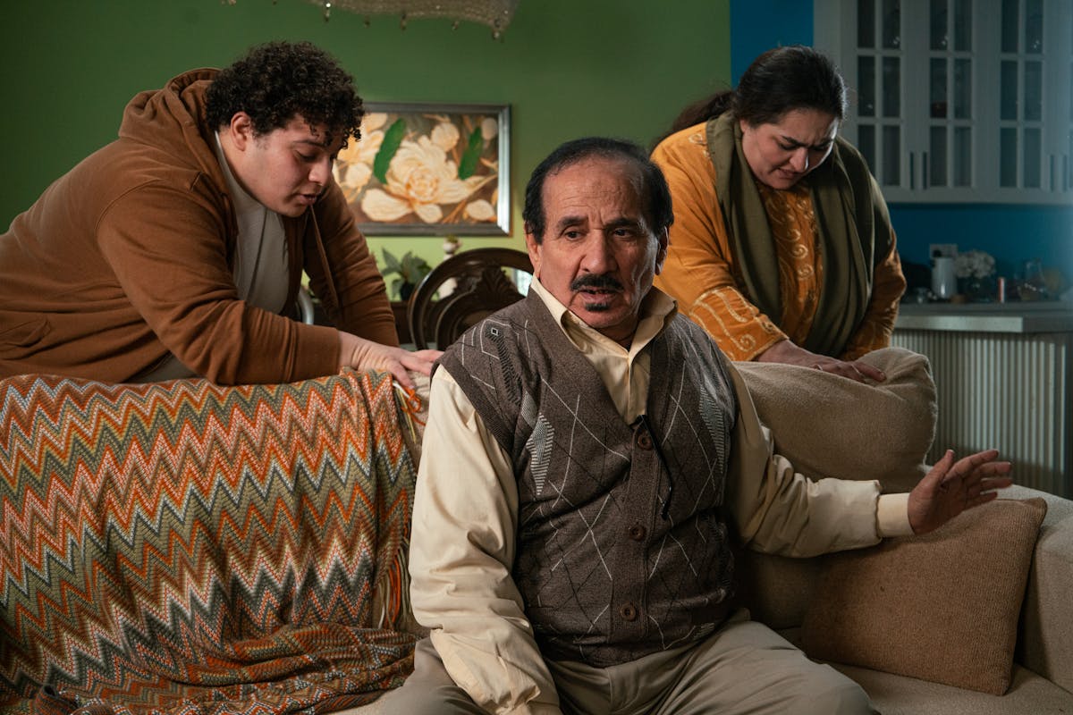 Family having a serious discussion in a living room