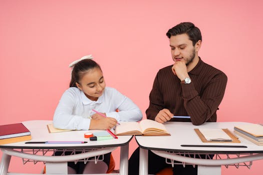 A teacher helps a student with schoolwork in an indoor learning environment.