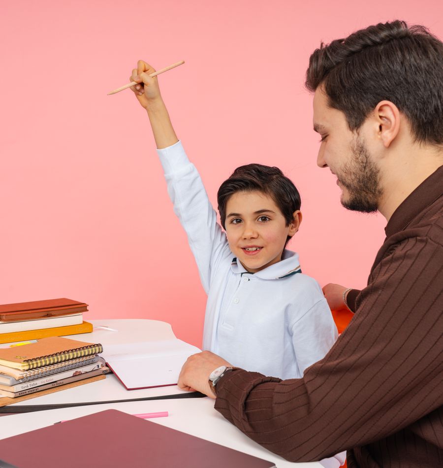 Teacher encouraging a child to participate in classroom learning