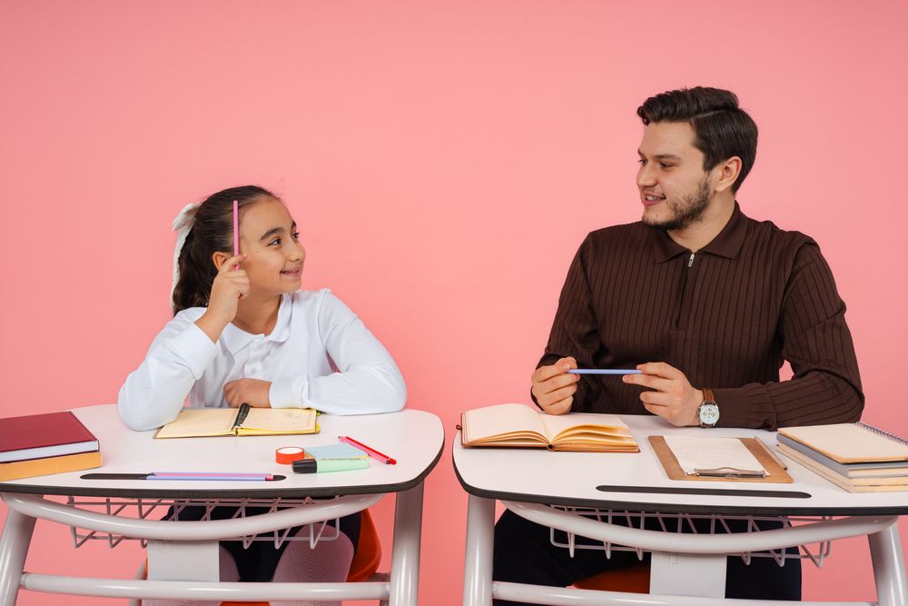 A Nova teacher guiding students through a project plan