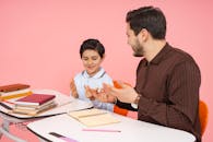 Teacher and Student Engaged in Learning Session