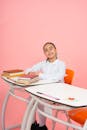 Confident Student Sitting at School Desk