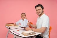 Teacher and Student Smiling in Classroom Setting
