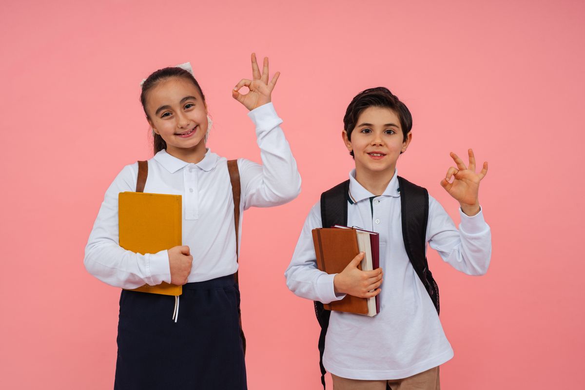 Happy Schoolboy with Book and Backpack · Free Stock Photo