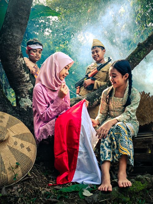 Free People in traditional attire gather in a forest in Banten, Indonesia, symbolizing cultural heritage. Stock Photo