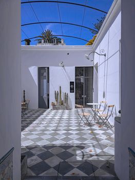 Experience a tranquil historic courtyard with natural light in Colonia del Sacramento, Uruguay.