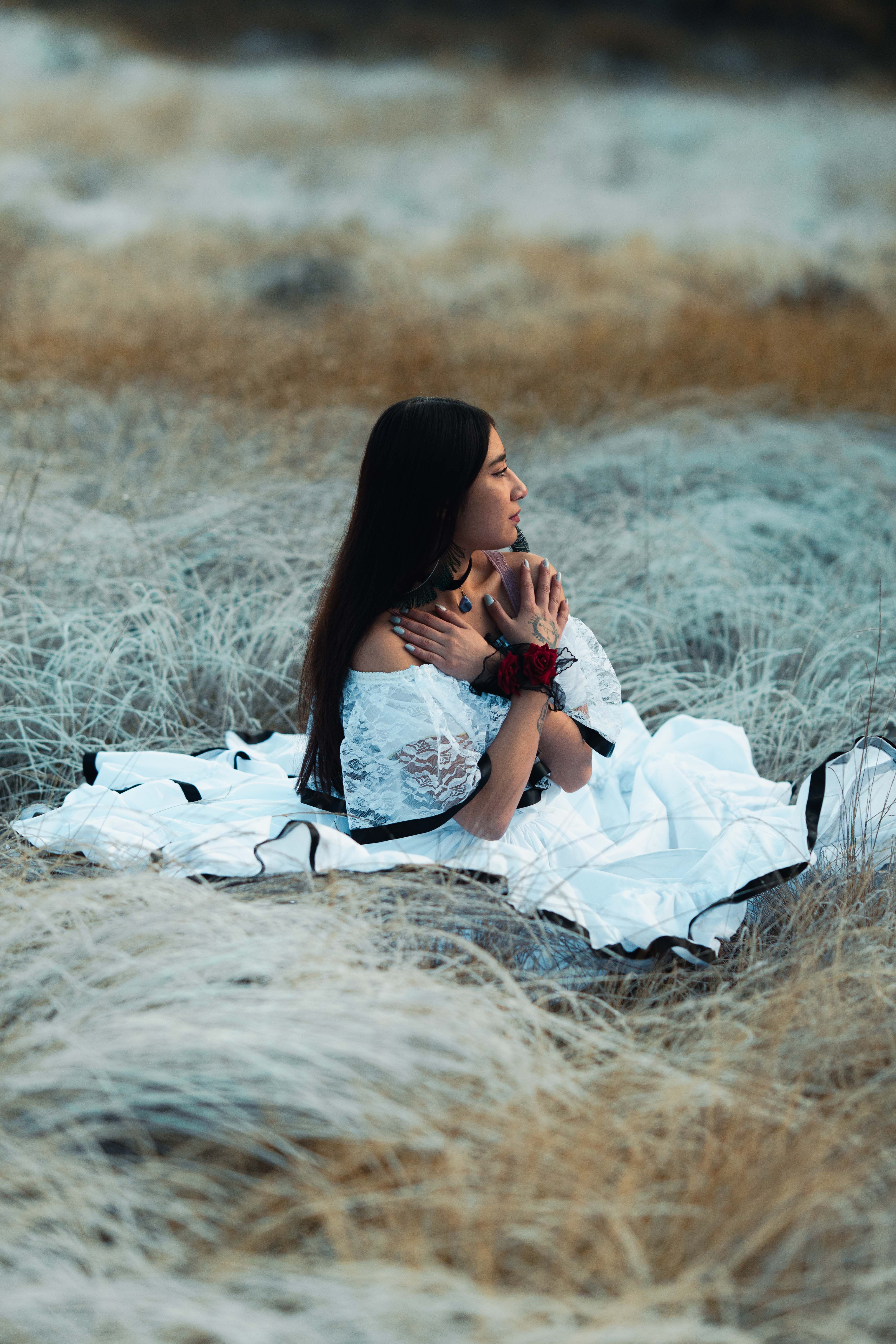 Woman in White Dress Sitting in Meadow · Free Stock Photo