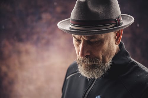 Photo Of Man Wearing Brown Fedora Hat