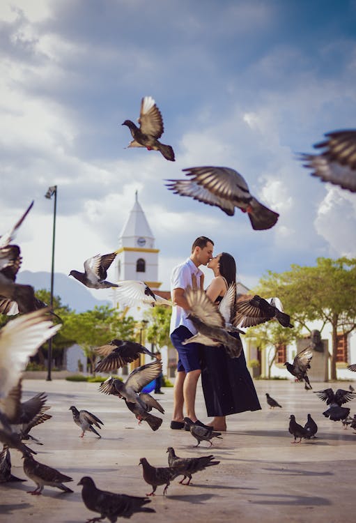 Photo Of Couple Kissing Surrounded By Birds