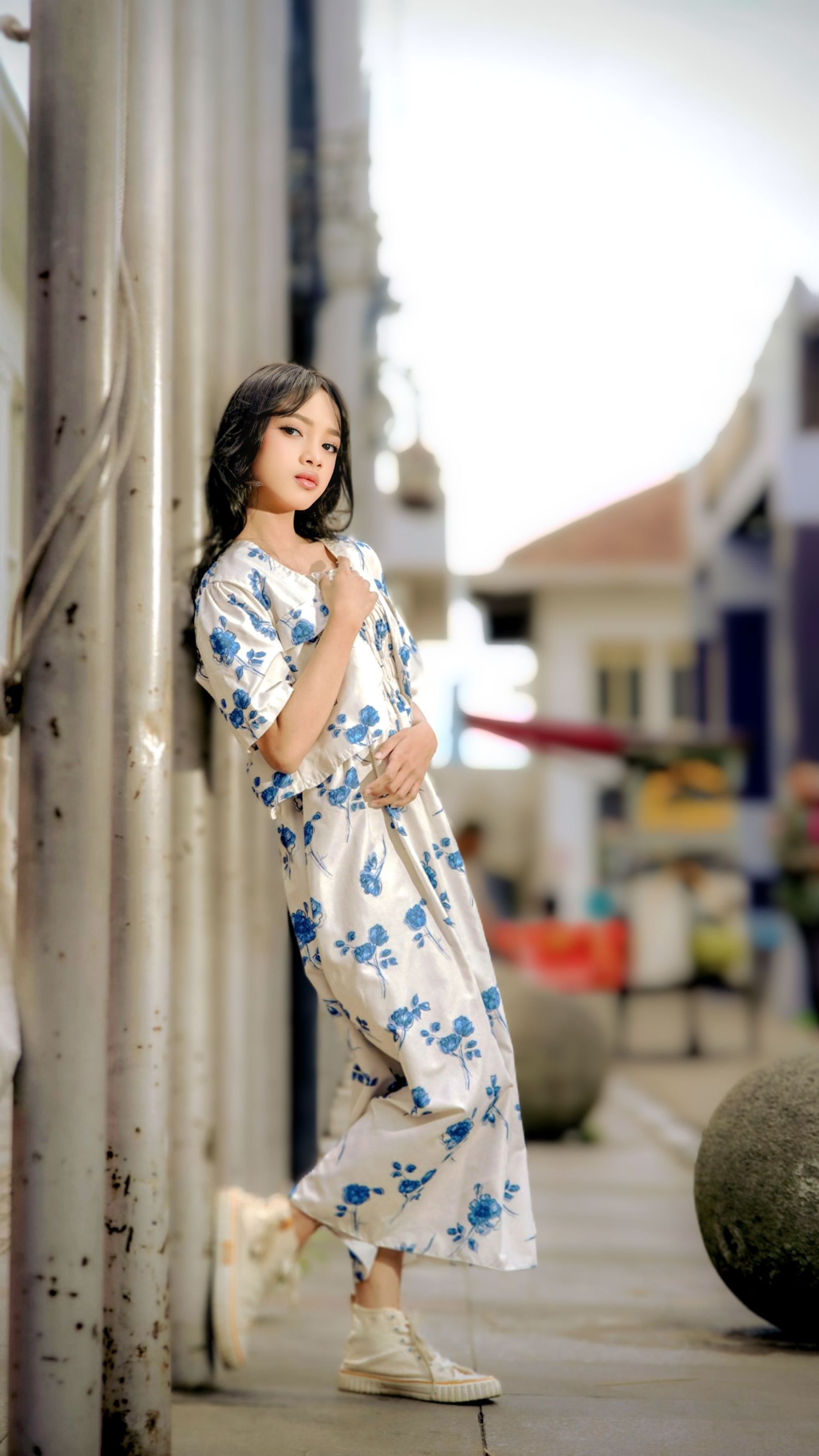 Stylish Woman in Floral Dress on City Street