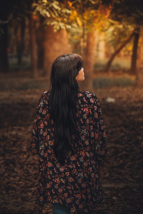 Woman in Black Cardigan Standing Near Trees · Free Stock Photo