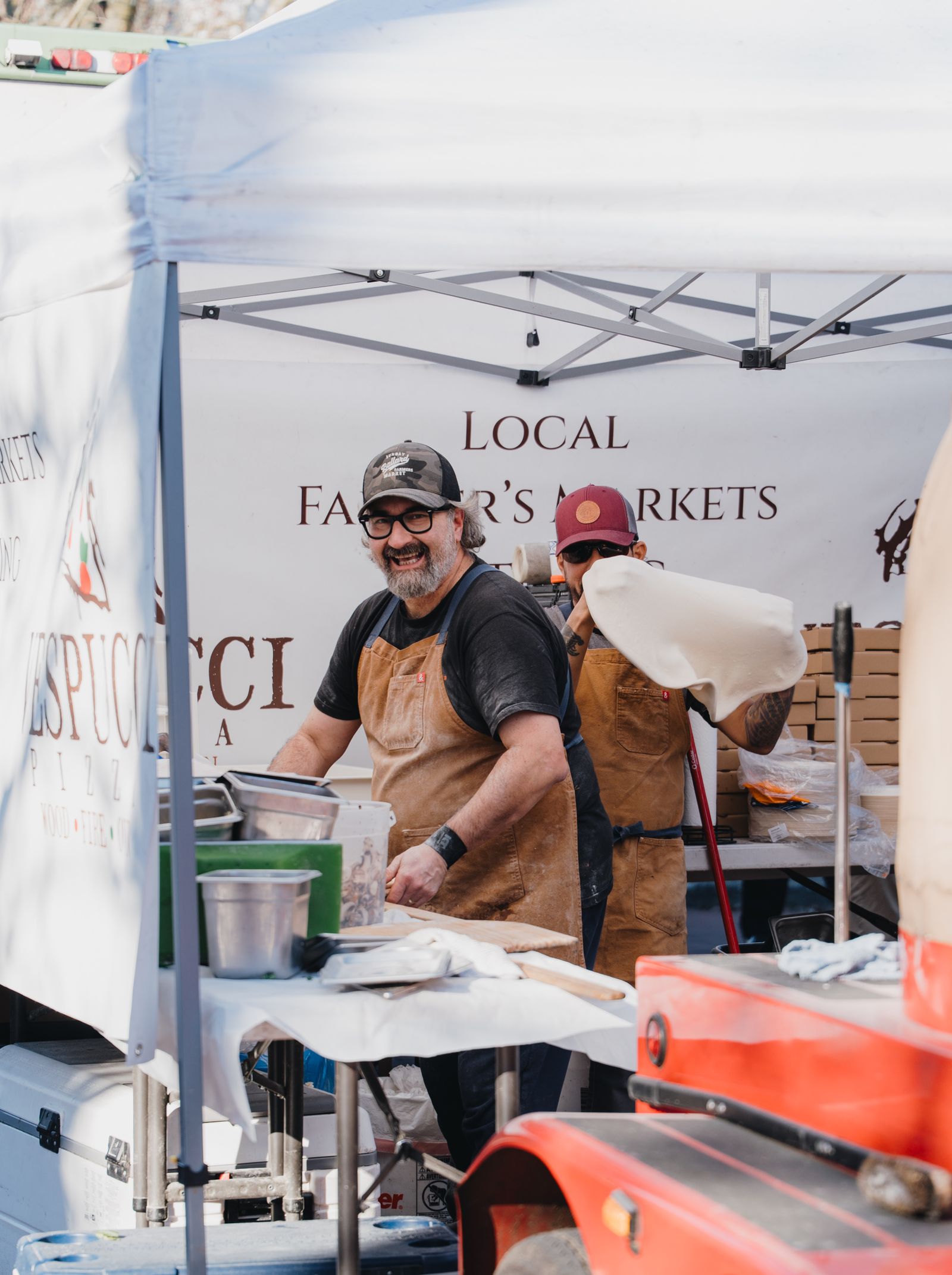 Seattle food market vendors preparing artisan foods, representing the Gobble Up Seattle food show
