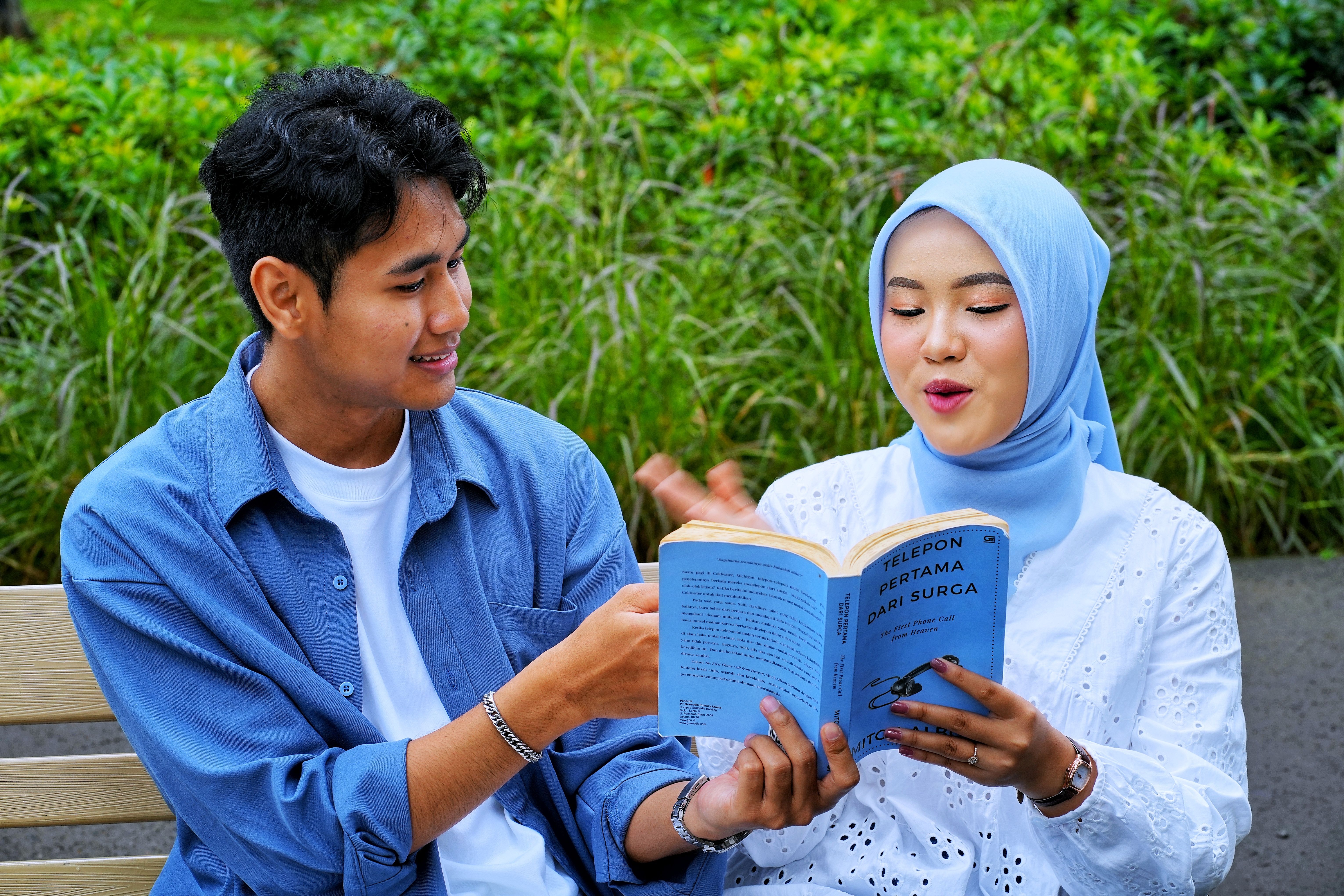 Young Couple Enjoying a Book in the Park