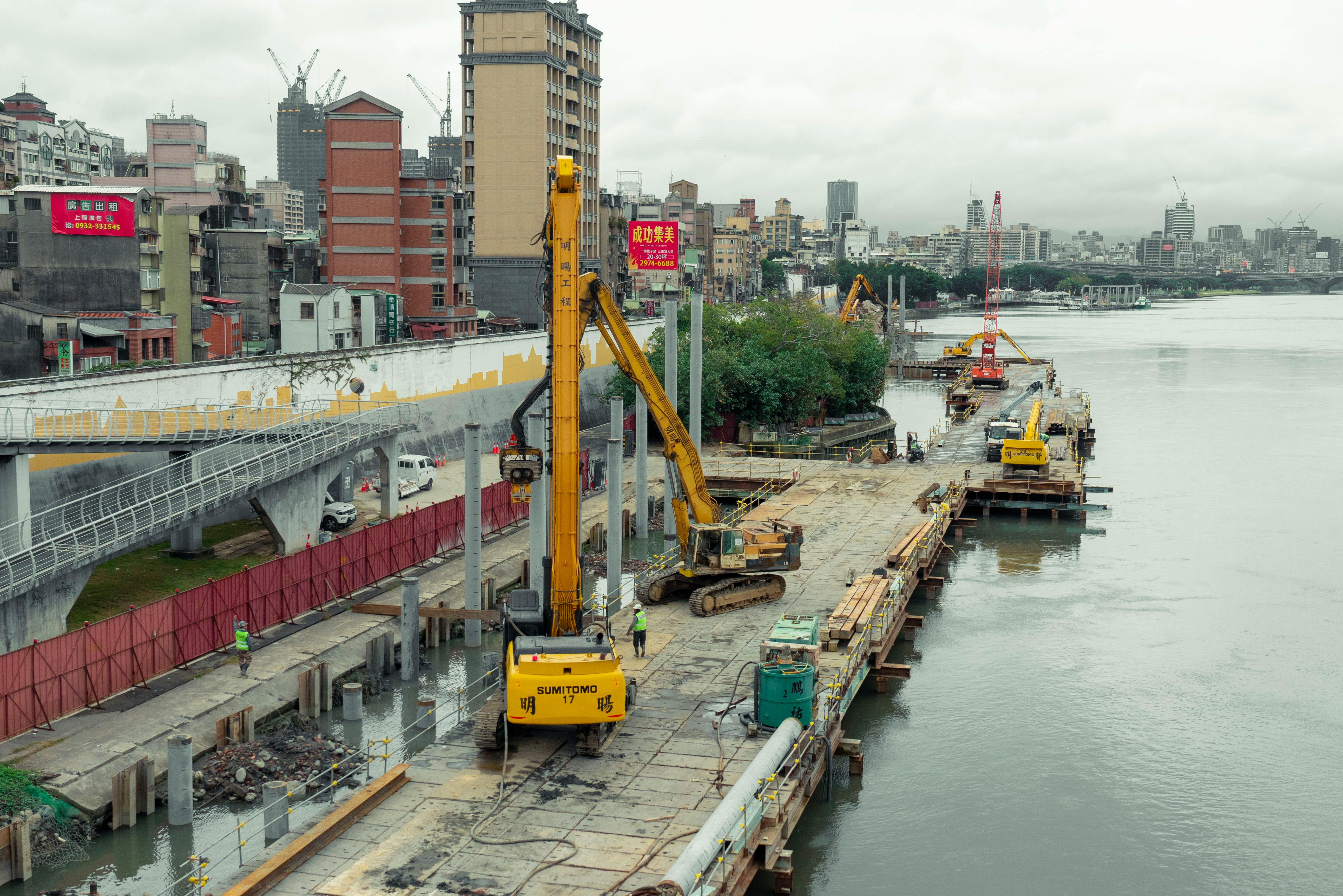 Urban Construction Site Along River in Taipei
