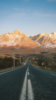 A picturesque road leading to snow-capped Taurus Mountains in Niğde, Türkiye.
