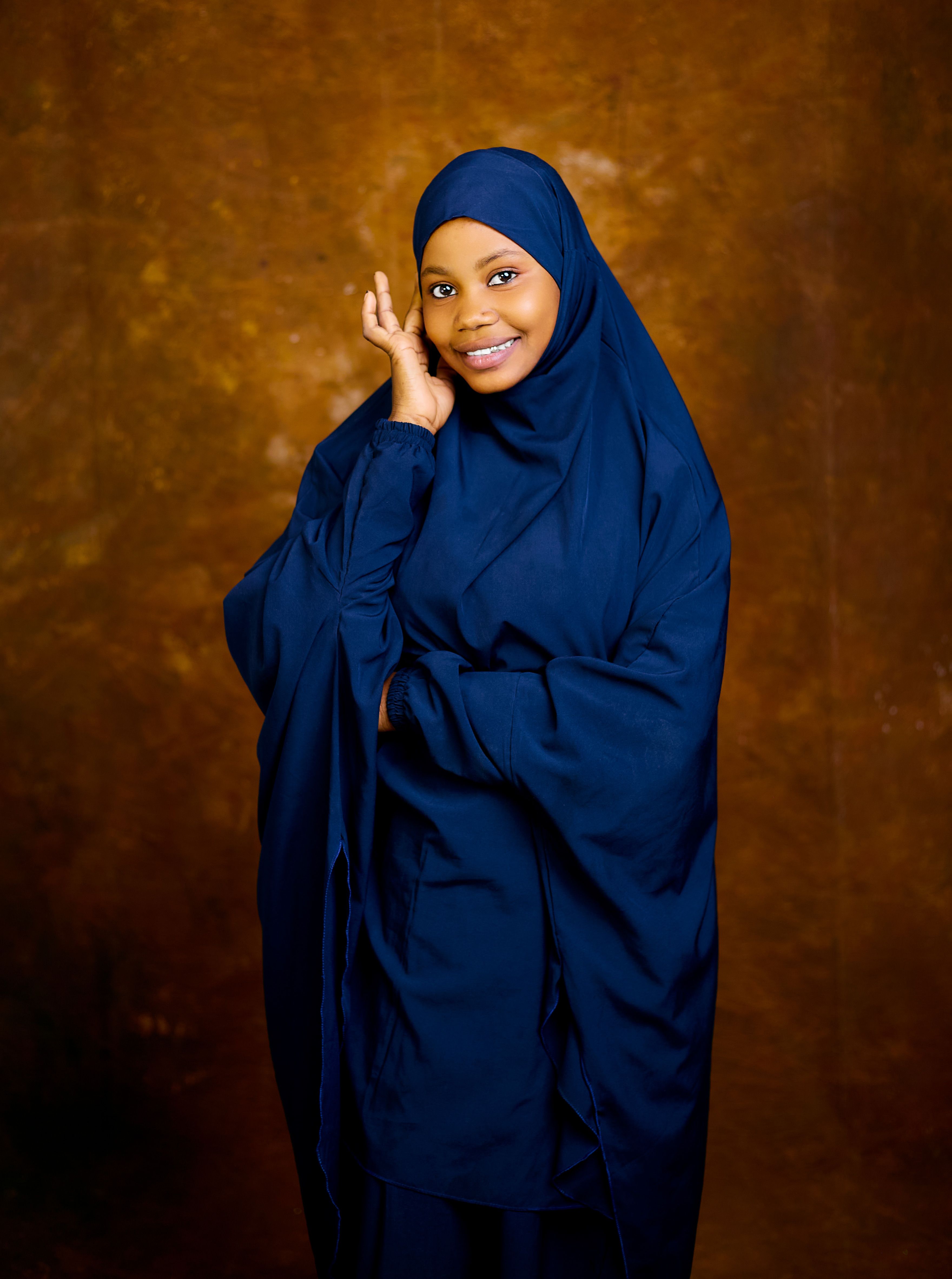 Elegant Portrait of Woman in Blue Hijab · Free Stock Photo