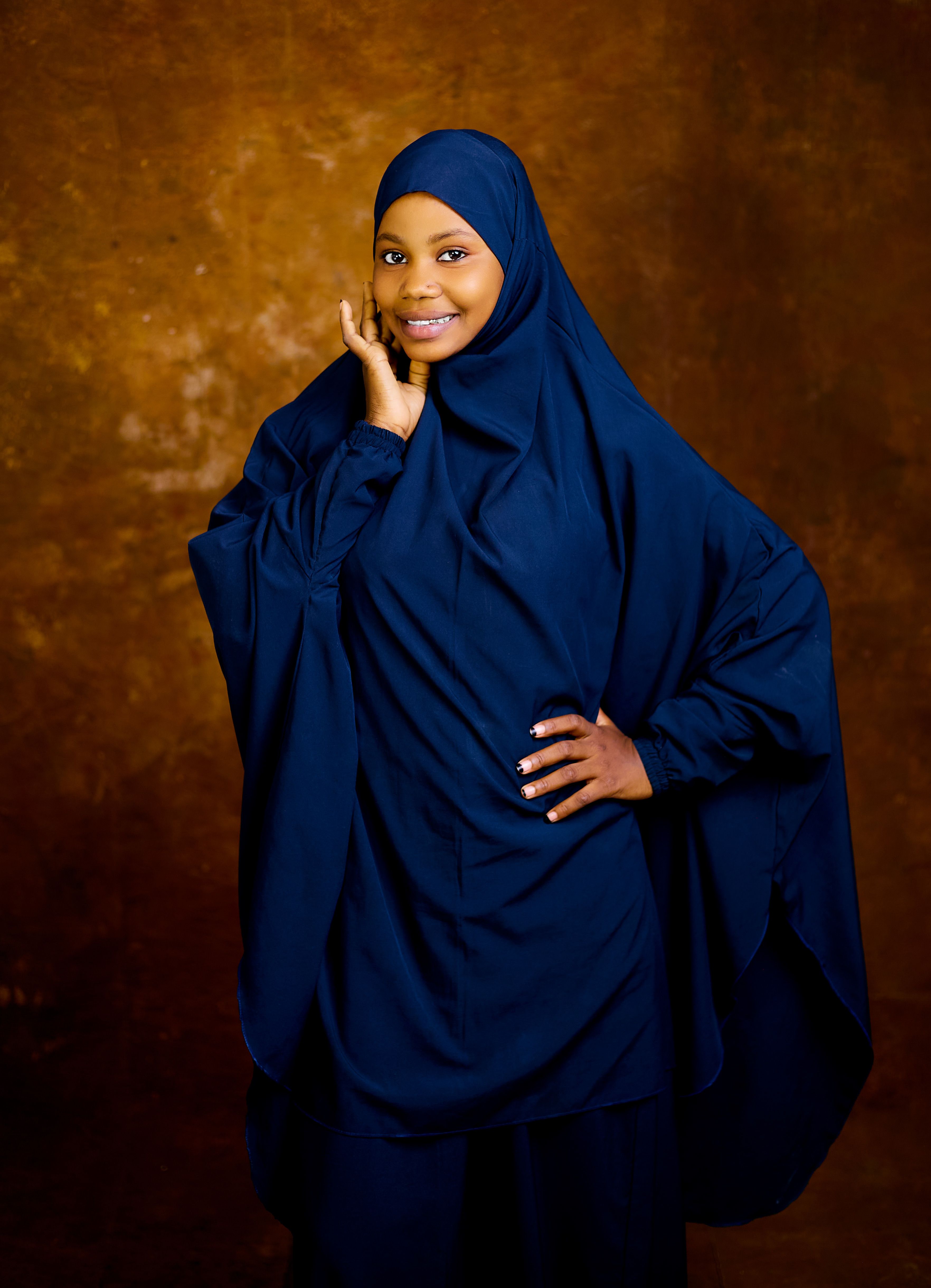 Young Woman in Elegant Blue Hijab Portrait · Free Stock Photo