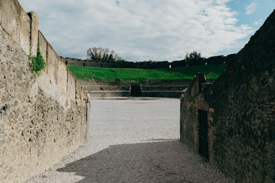 Explore the historic ruins of the ancient amphitheater in Pompeii, Italy.