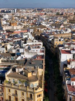 A vibrant aerial view of Seville, showcasing its historic architecture and lively streets.