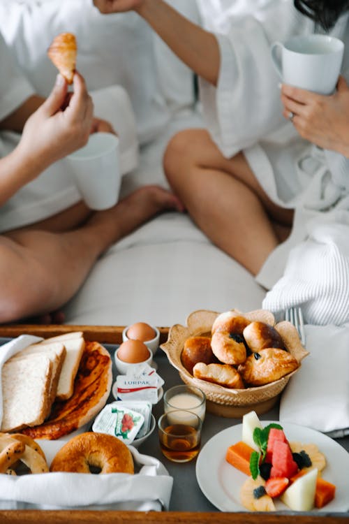 Free  People Eating On The Bed Stock Photo
