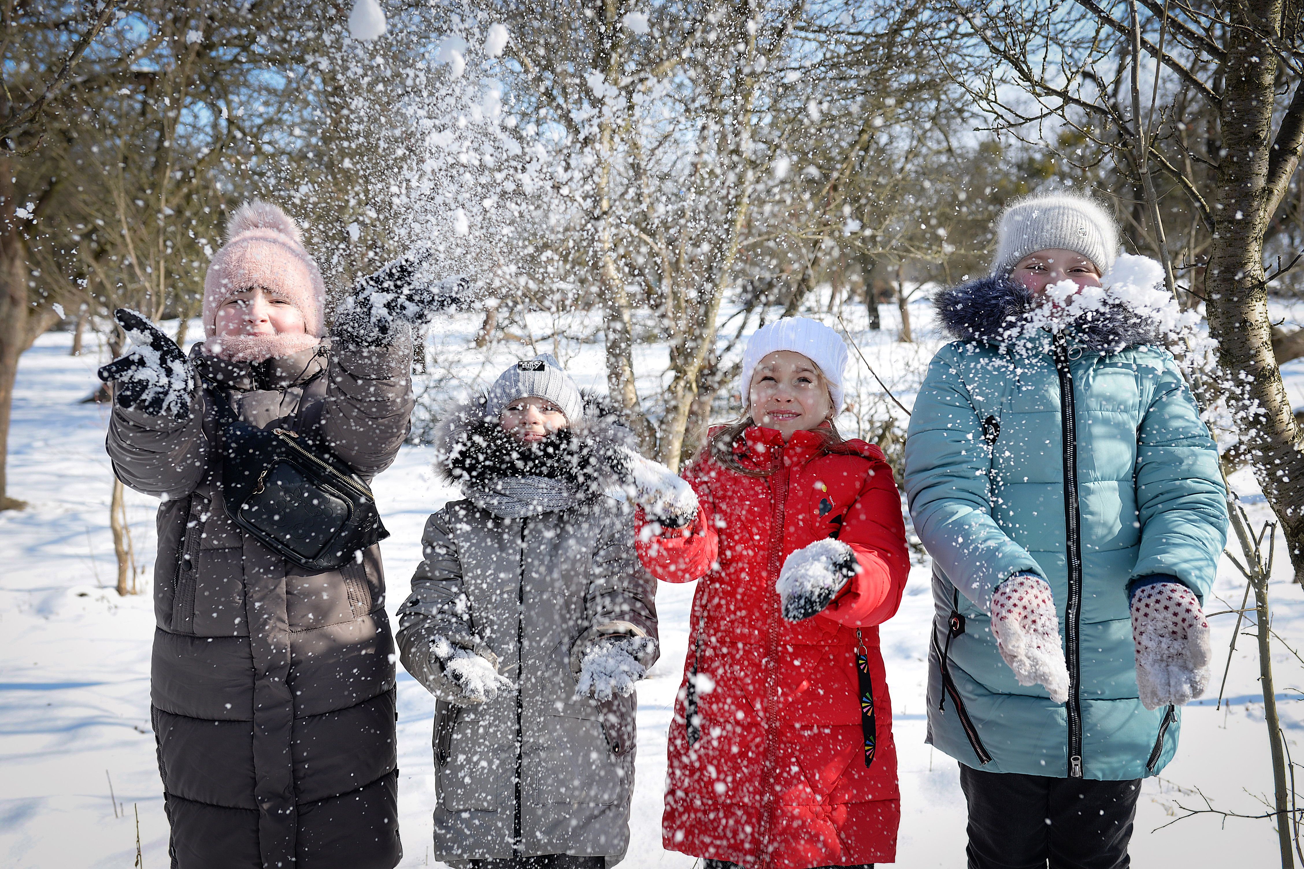 Children Playing Joyfully in Winter Snow · Free Stock Photo