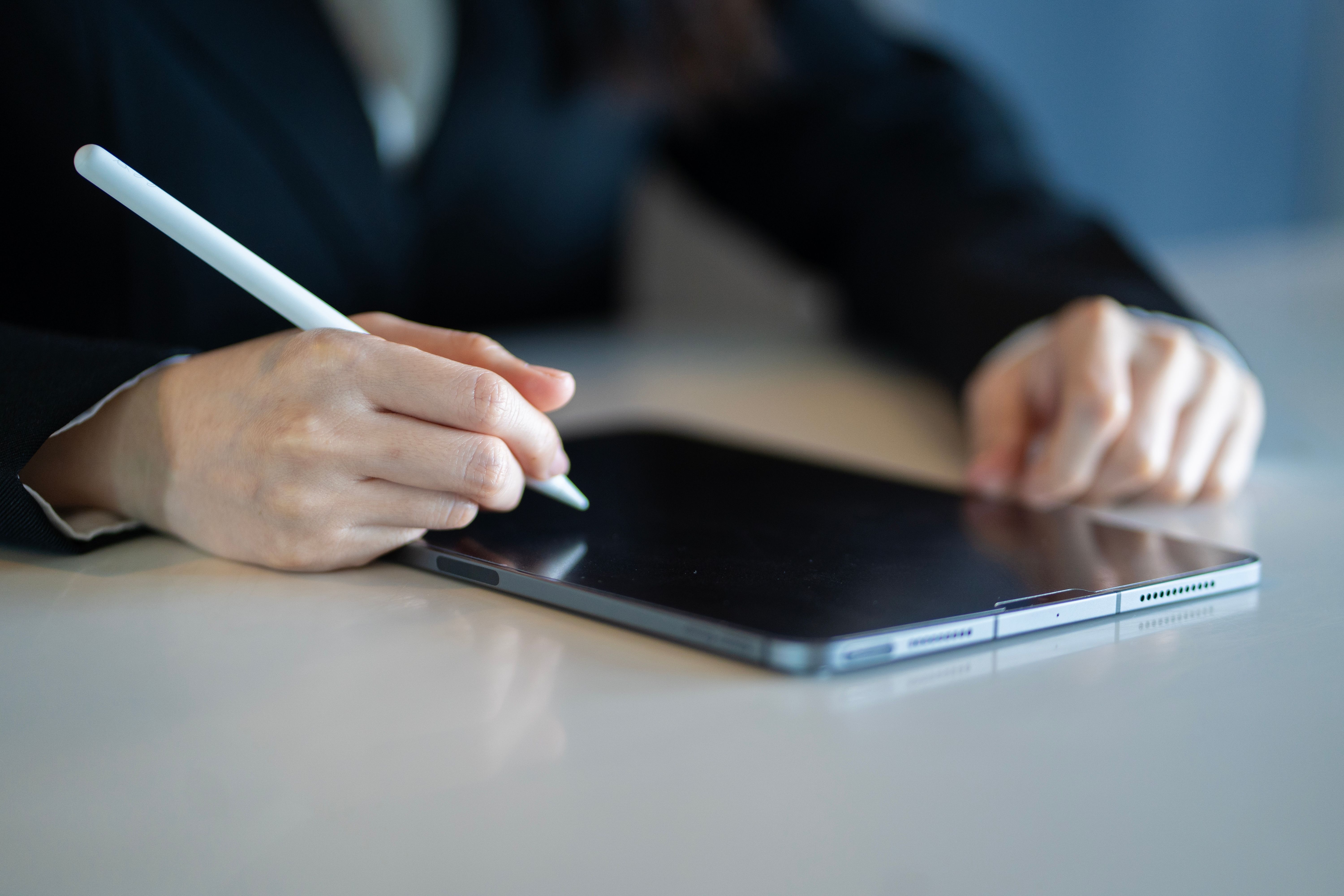 Person Writing Notes on White Ruled Paper · Free Stock Photo