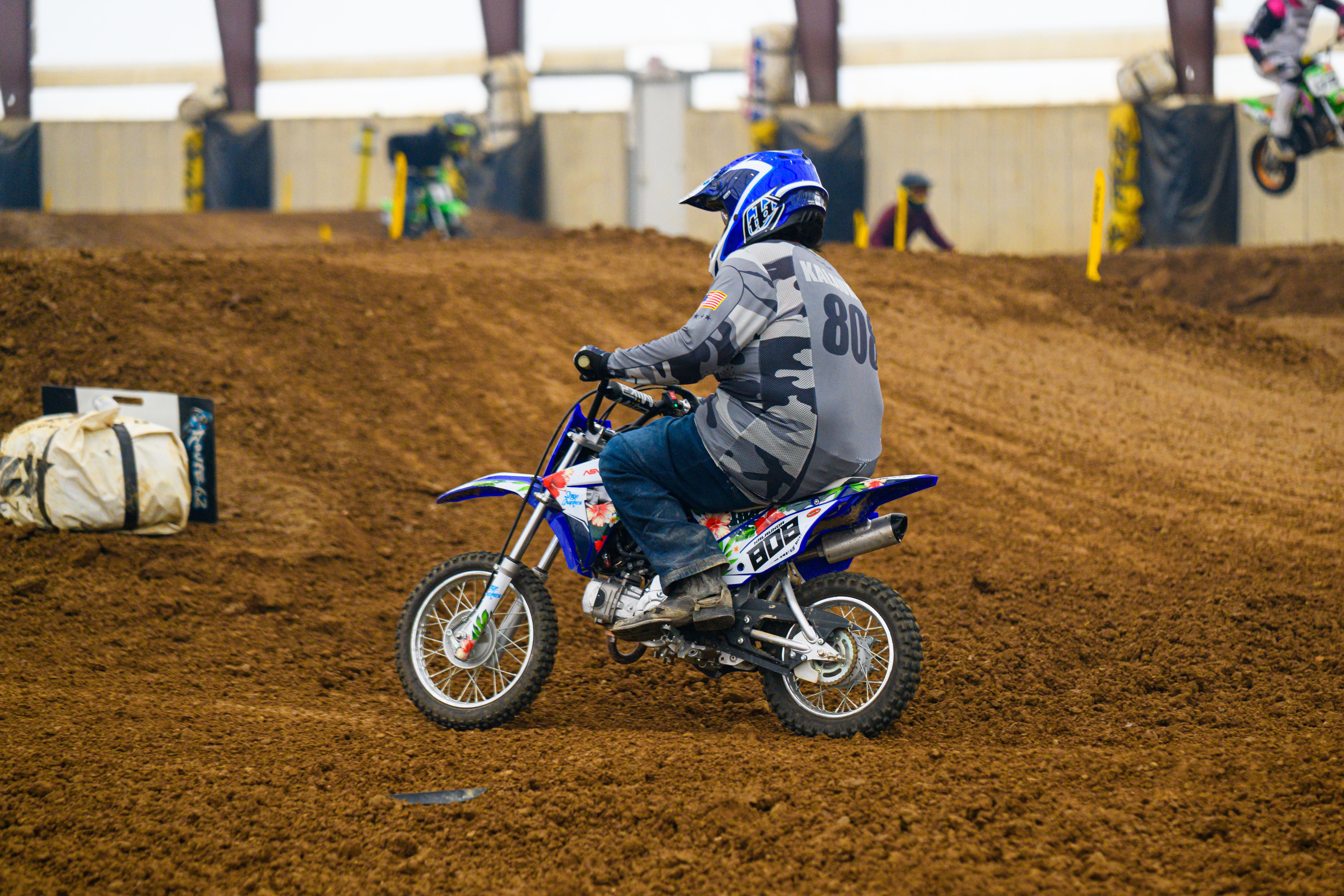 Action-packed dirt bike race at an indoor track in Martinsburg, Ohio.